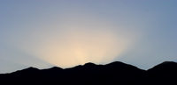 Sun was rising from behind the mountains.../  - ...